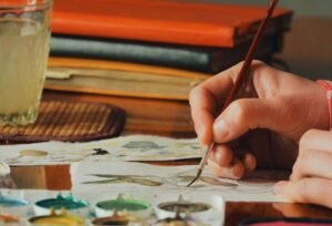 Female artist painter painting a picture of a east PZ43TF4