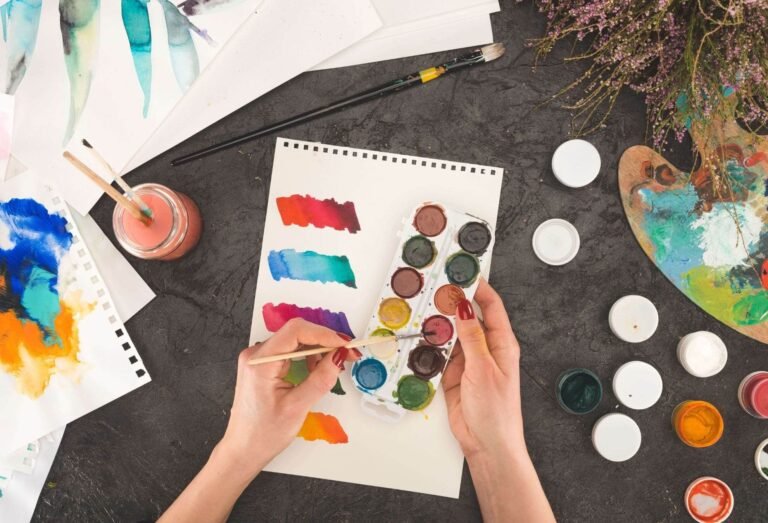 Cropped image of artist mixing watercolor paints 697KMLE.jpg