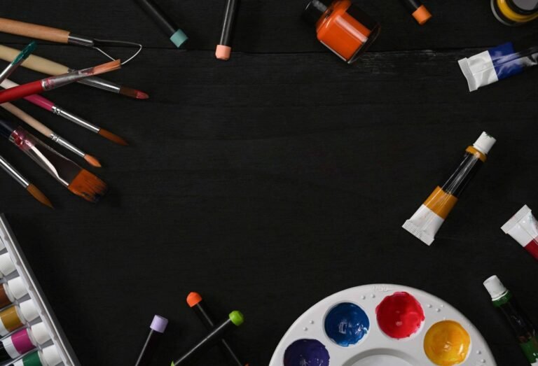 Flat lay watercolors palette and paint brushes on KM6HKMQ.jpg